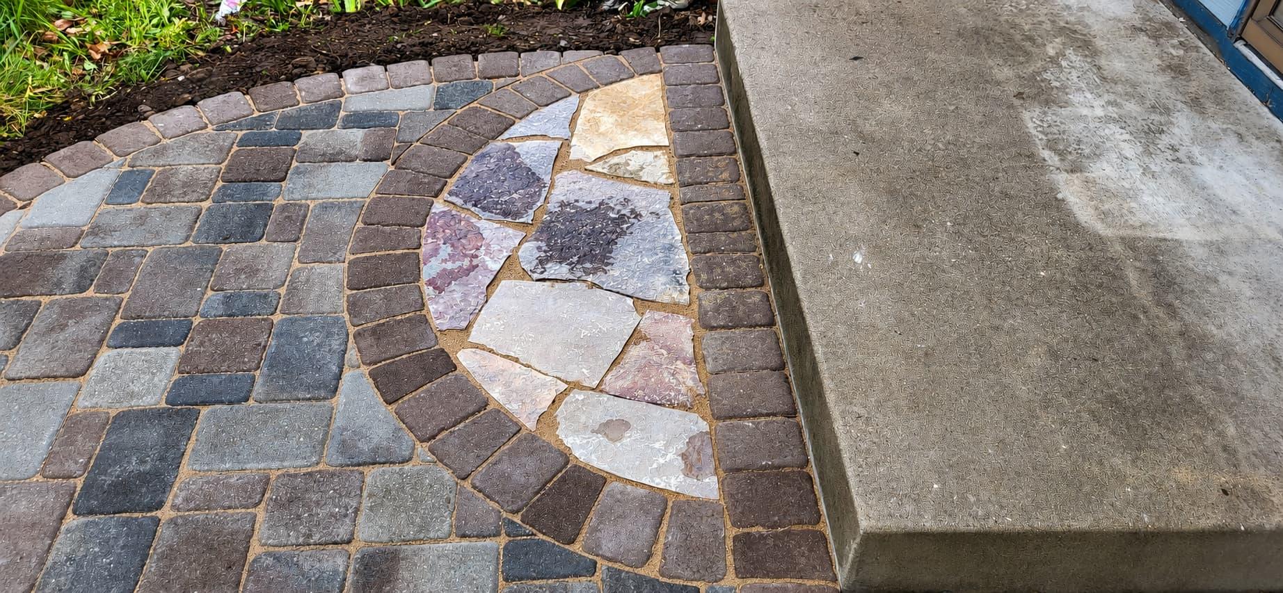 Decorative circular paver-and-flagstone mosaic detail